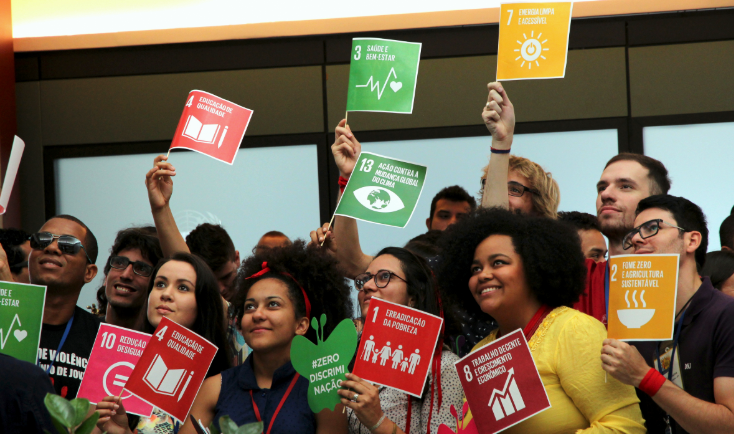 People holding SDG posters