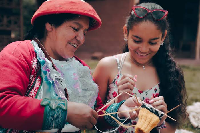Girl weaving in Cusco Peru