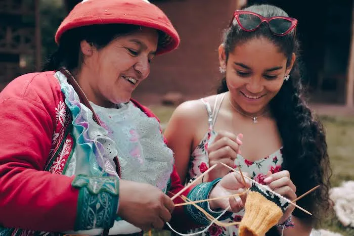 Girl weaving in Cusco Peru Girl weaving in Cusco Peru