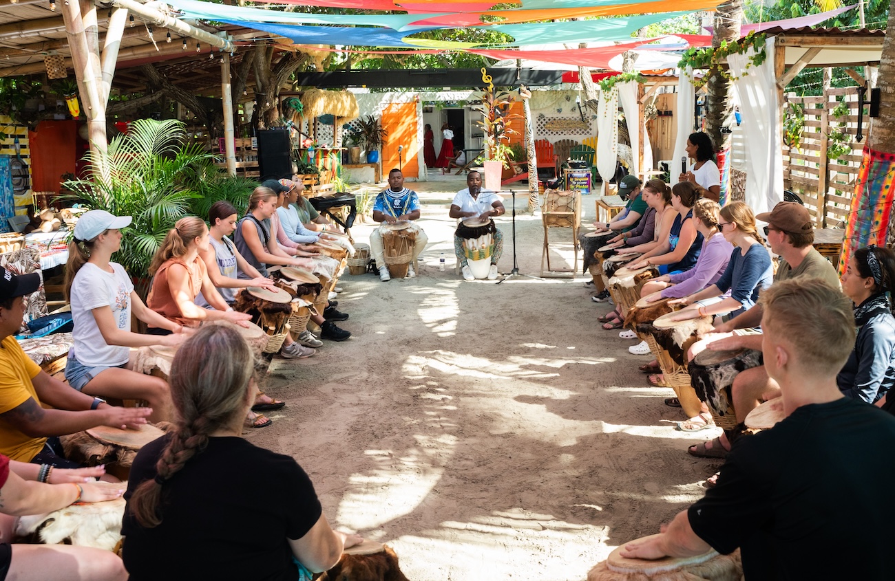 Students on Spanish trip playing drums