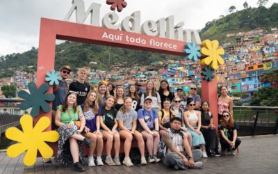 Students posing and smiling in Medellin during alternative break