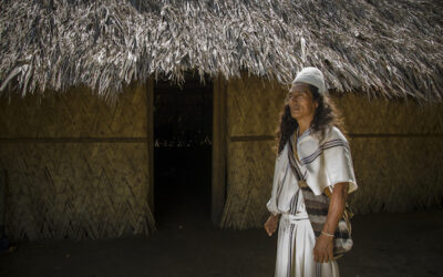 Tourism-affect-locals-Colombia-Arhuaco Man in standing in front of native house