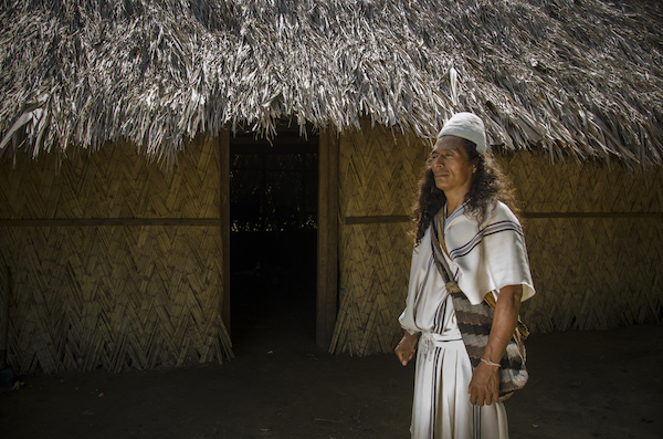 Tourism-affect-locals-Colombia-Arhuaco Man in standing in front of native house