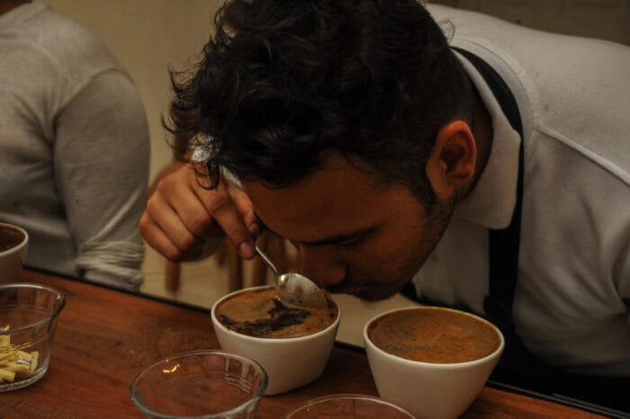 man sniffing colombian coffee