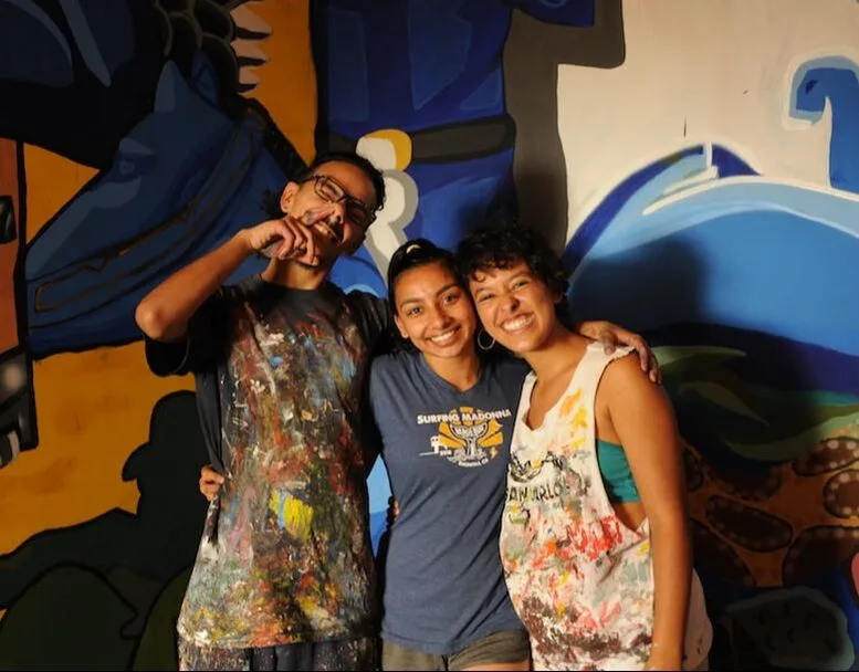 Students hugging and smiling on a study abroad trip