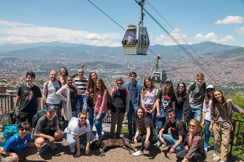 students stood in front of medellin valley