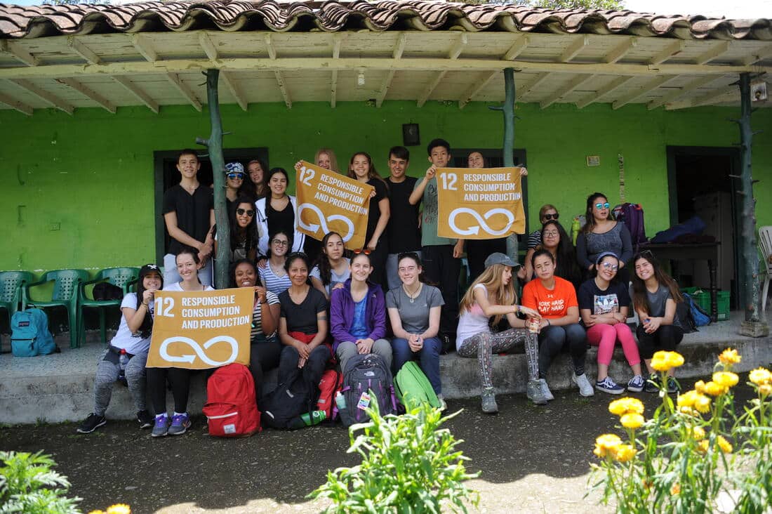 university students holding sdg flags